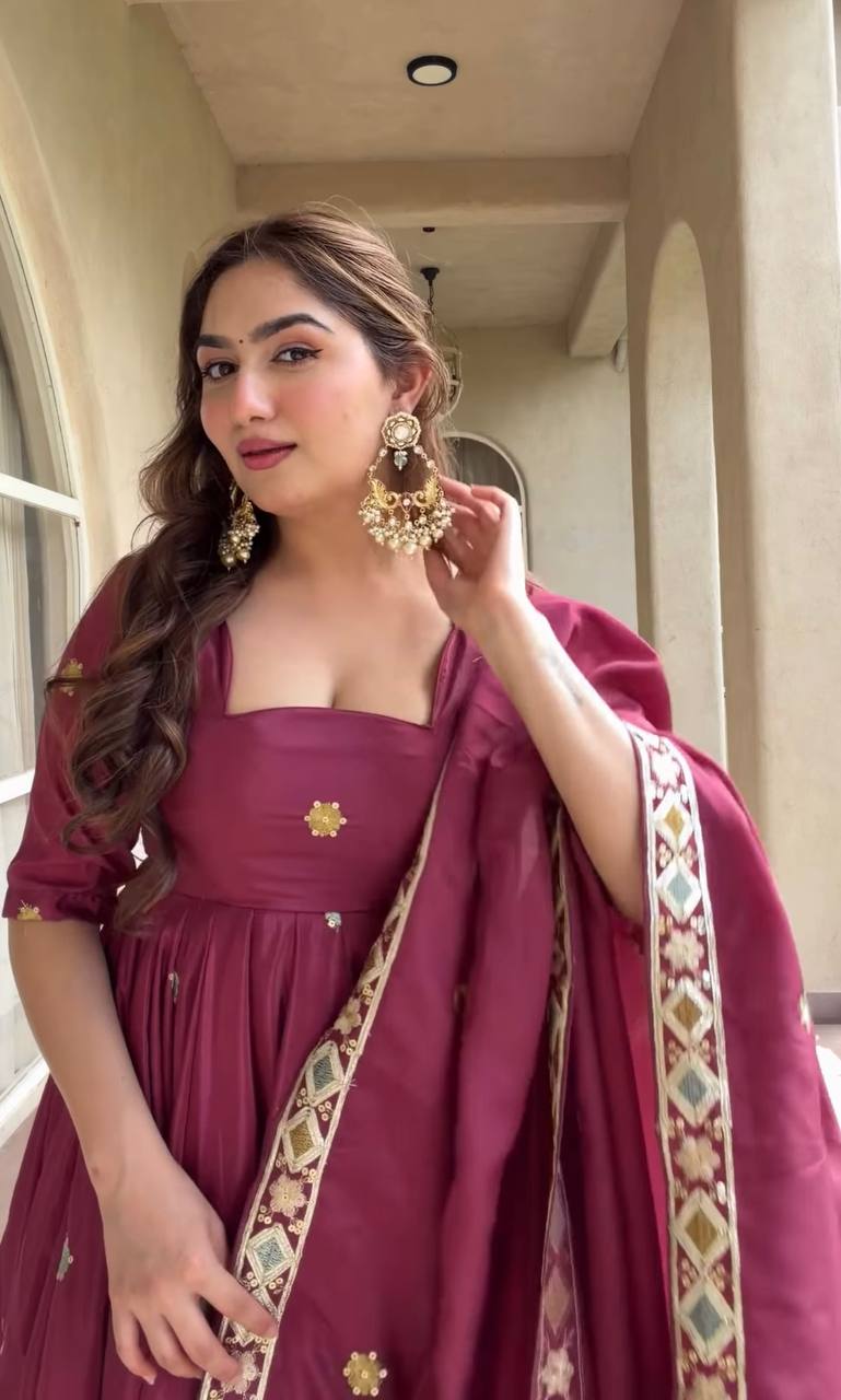 Majestic Wine Flared Anarkali Suit Set Adorned with Delicate Floral Scattered Motifs and an Ornate Heritage Embroidered Border